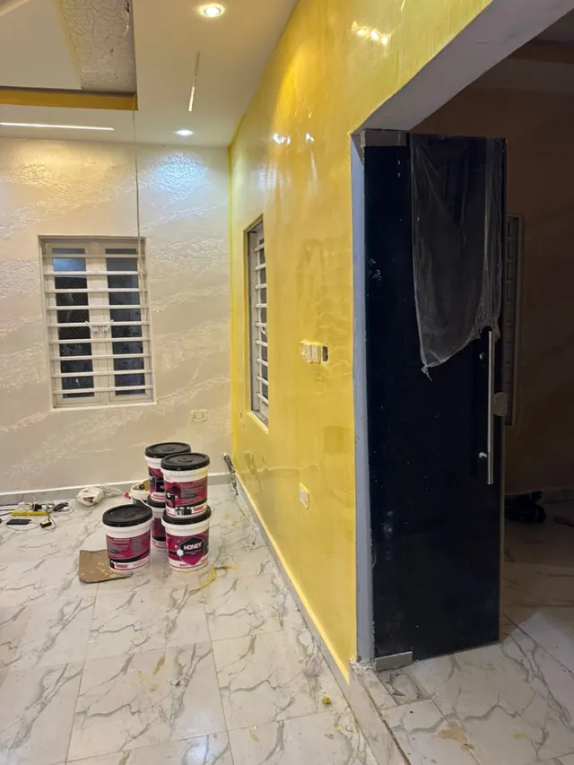 Cream and gold corridor with recessed ceiling lights