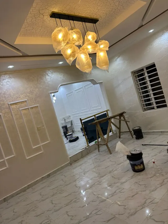 Bright cream living room with decorative wall moulding