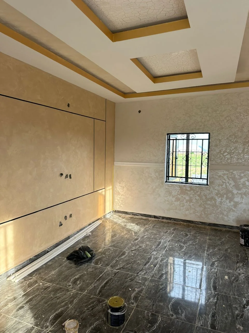 Gold ceiling trim aligned with neutral wall details