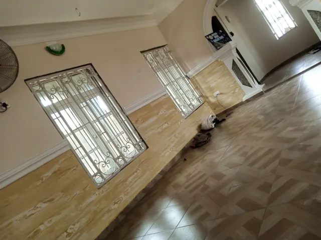 Warm neutral living area with glossy patterned floor