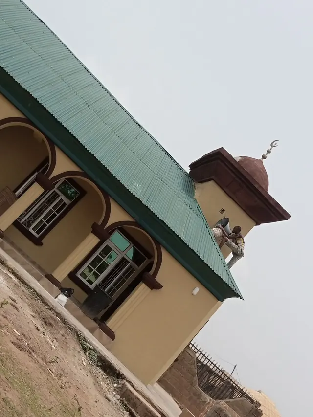 Cream, green and brown residential exterior